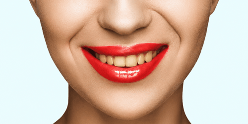 cropped-view-of-gorgeous-smiling-woman-with-red-li-2026-03-12-22-47-13-utc-1.png